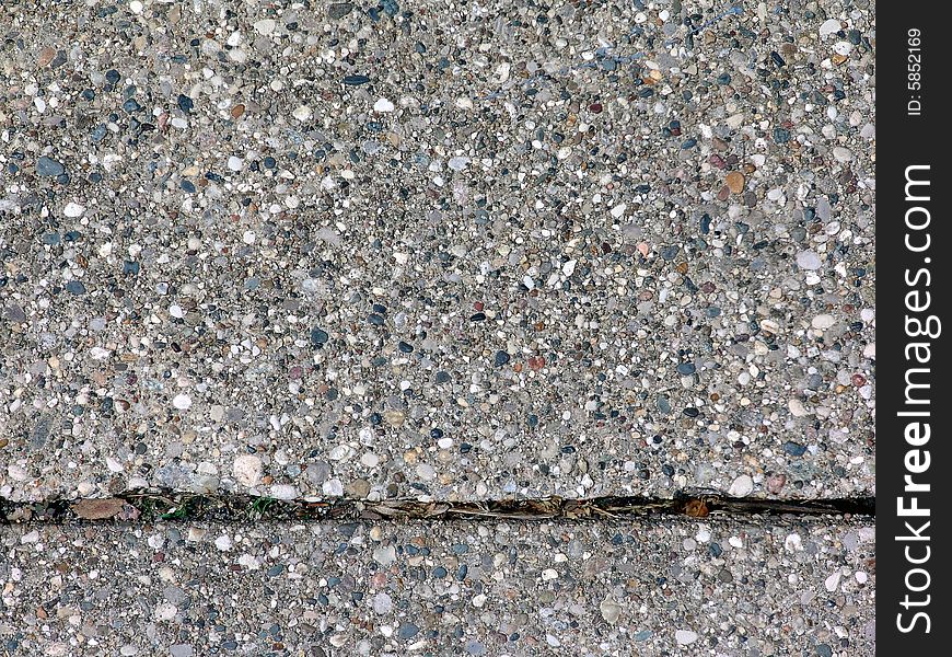 Close-up of two sections of concrete sidewalk