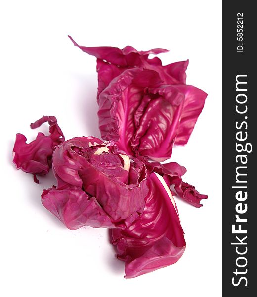 Red cabbage leaves on white background
