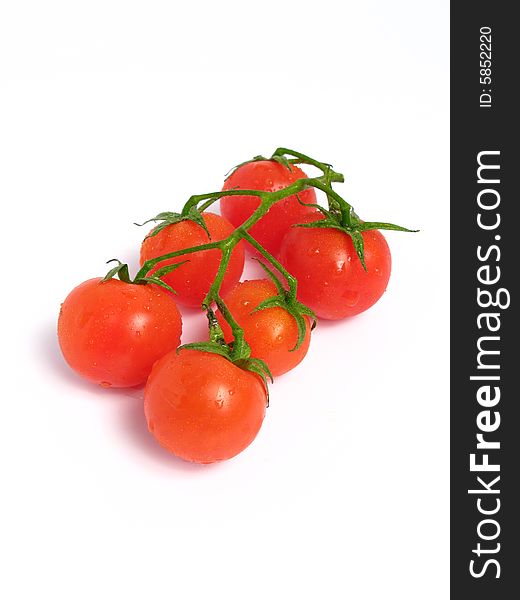 Cherry tomatoes together on a white background