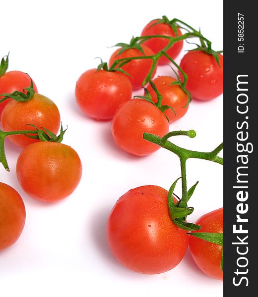 Cherry tomatoes together on a white background