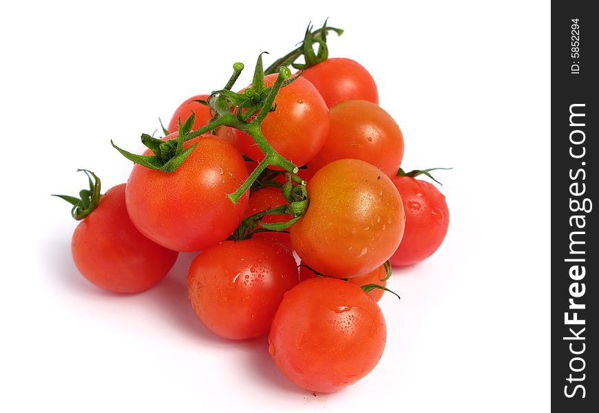 Cherry tomatoes together into a pyramid  on a white background