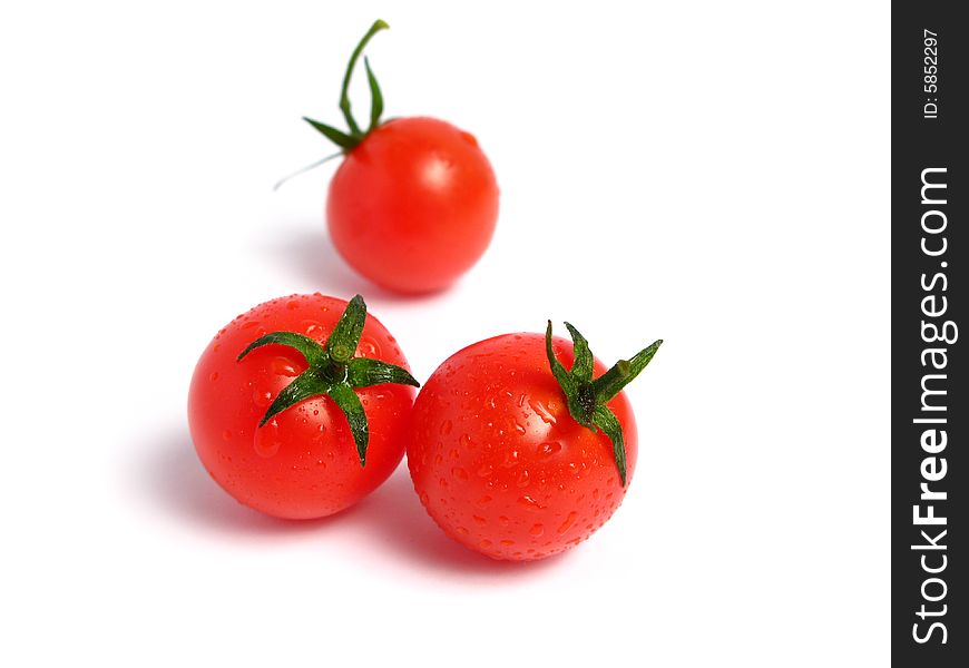Cherry tomatoes together on a white background