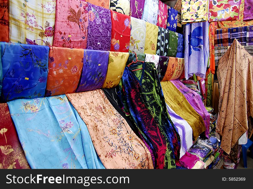 Rows of beautiful and colourful fabrics inside textile shop for sale. Rows of beautiful and colourful fabrics inside textile shop for sale.