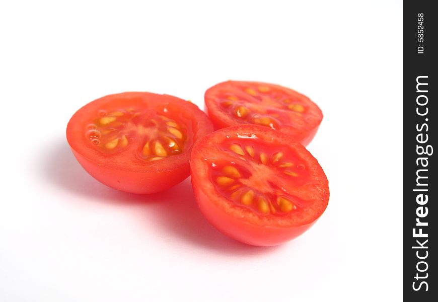 Half cherry tomatoes together, on a white background