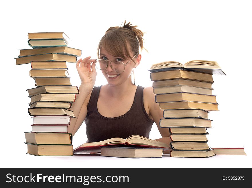 Young woman and a pile of books