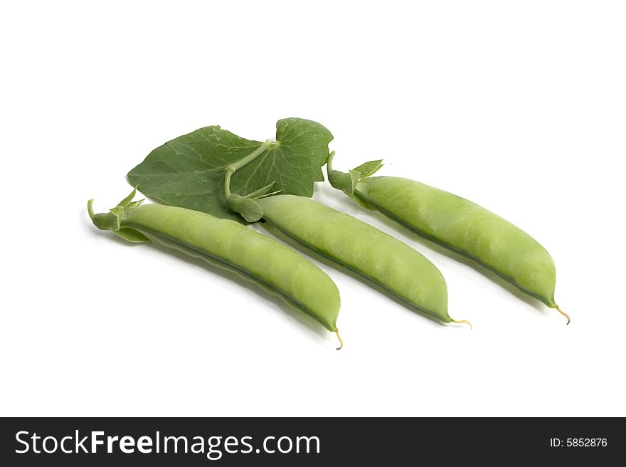 Green peas on white a background