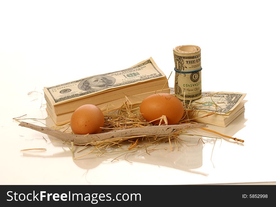 Stack of money and nest eggs
