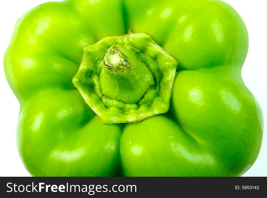 A closeup photograph of a bell pepper against a white background. A closeup photograph of a bell pepper against a white background