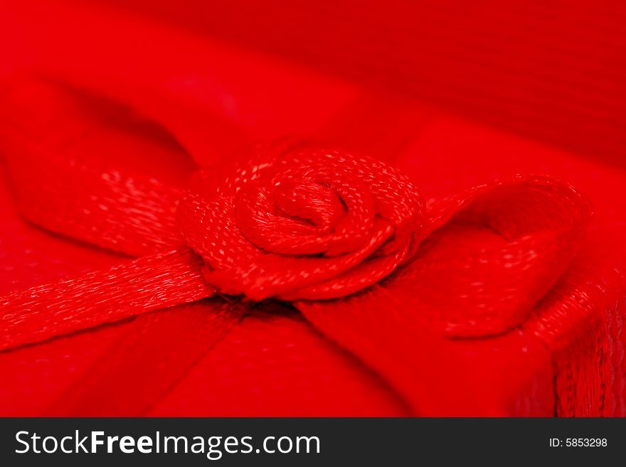 Close up shot of a red rose ribbon.