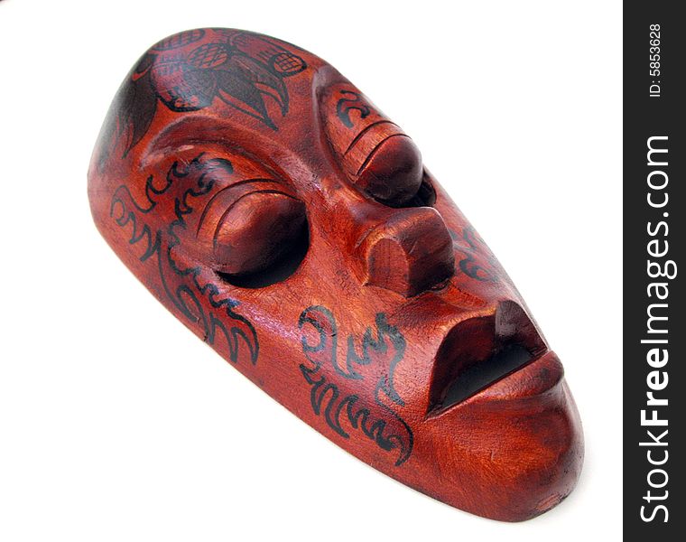 Carved wooden mask on white background