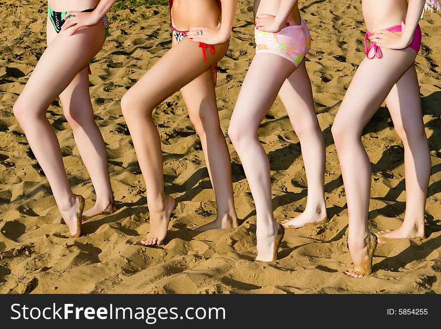 Beautiful female legs on sand. Beautiful female legs on sand