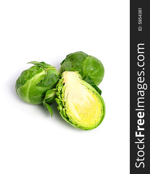 Fresh organic Brussels sprouts on white background