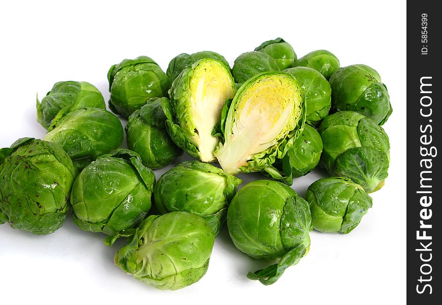 Fresh organic Brussels sprouts on white background