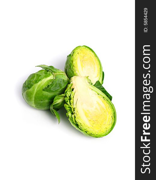 Fresh organic Brussels sprouts on white background