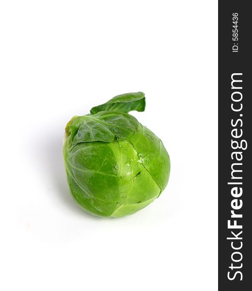 Fresh organic Brussels sprouts on white background