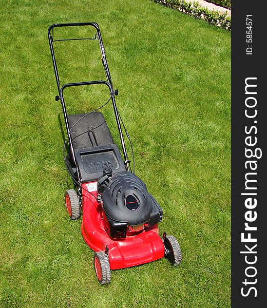 Lawn mower in the  grass