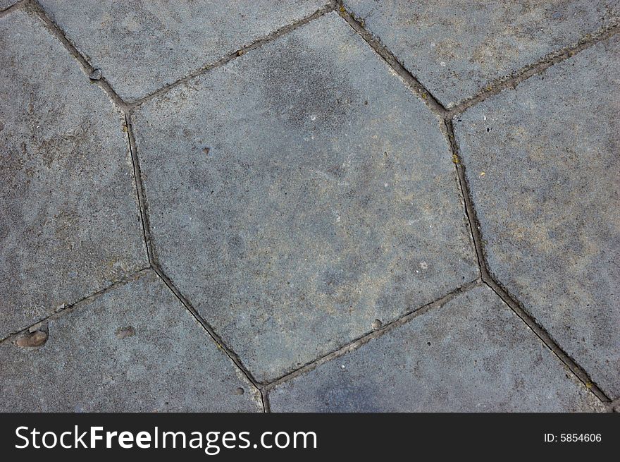 Close-up of new old-style pavement of stoneblocks (bricks) of grey color