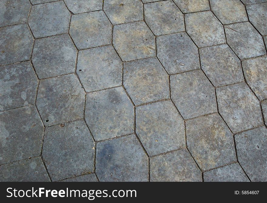 Close-up of new old-style pavement of stoneblocks (bricks) of grey color