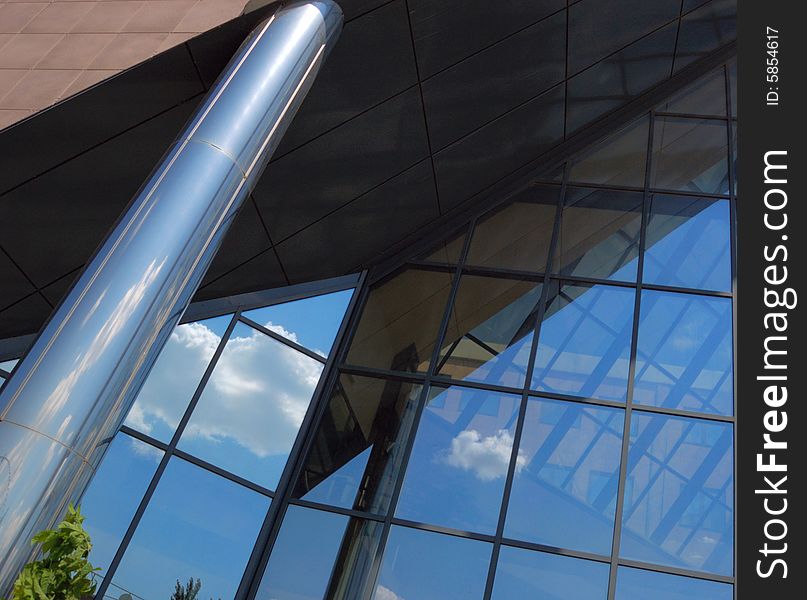 Front of new modern office building with reflections of clouds. Front of new modern office building with reflections of clouds