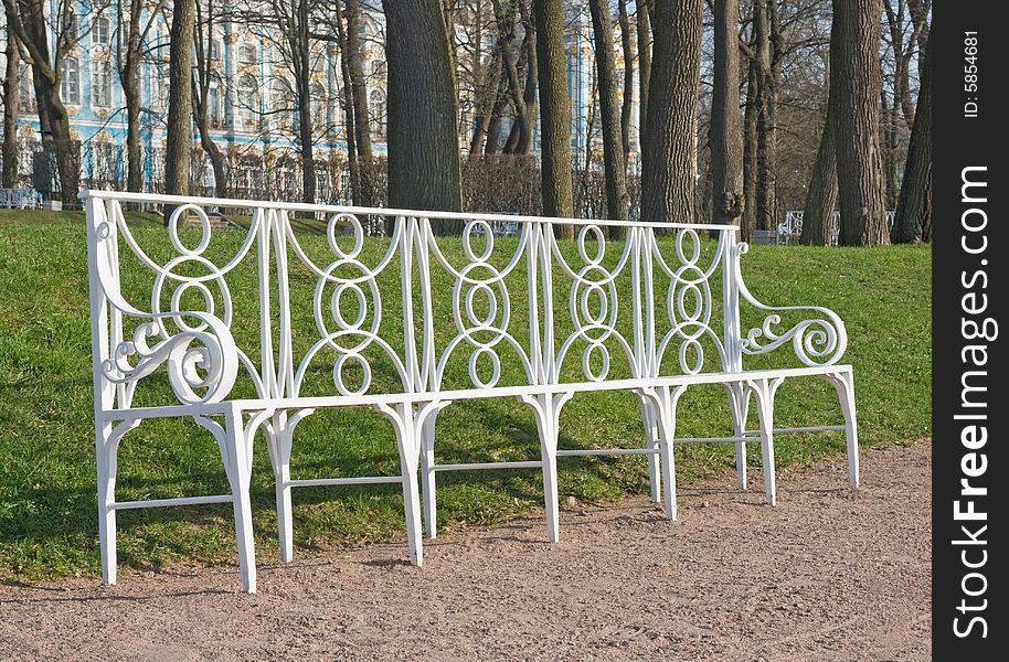 Laced metal bench in a park lane, town of Pushkin, Russia. Laced metal bench in a park lane, town of Pushkin, Russia