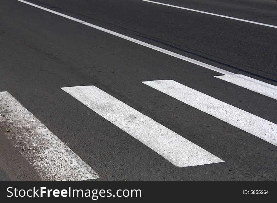 Pedestrian crossing on asphalt road