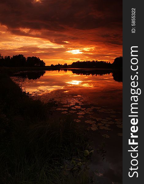 Lake at sunset with reflection in Finland