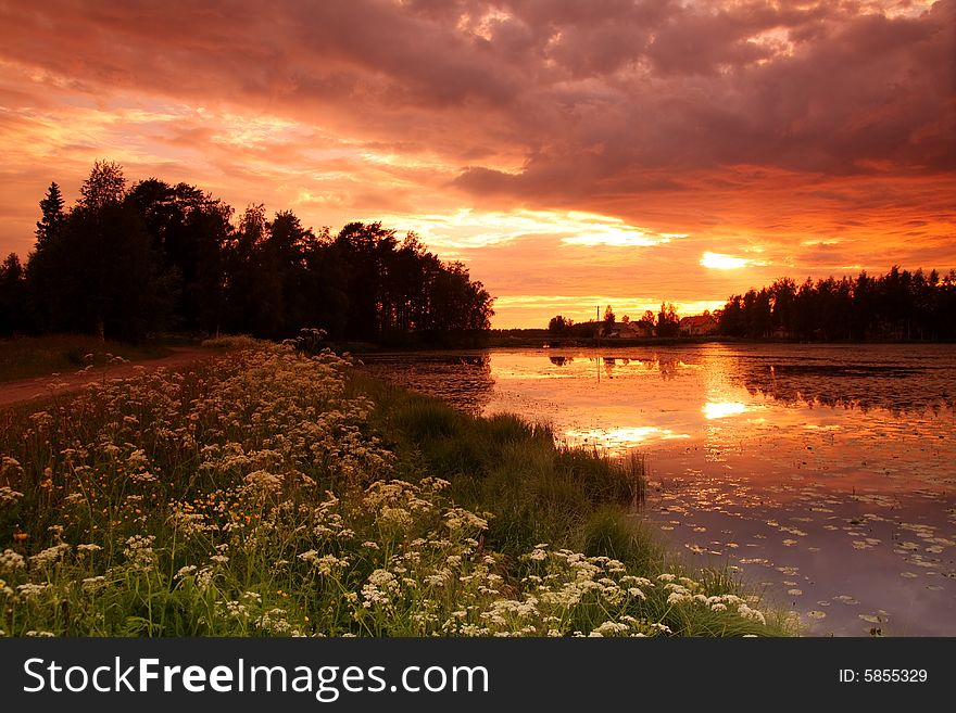 Lake at sunset with reflection in Finland