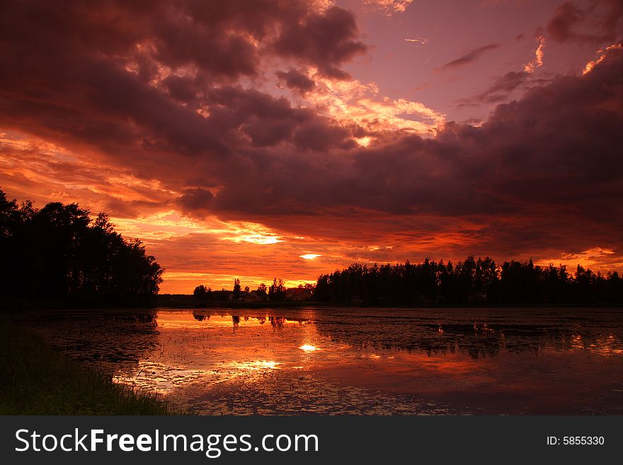 Lake at sunset with reflection in Finland