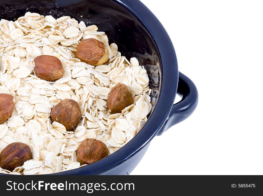 A bowl of oatmeal with hazelnuts - healthy diet