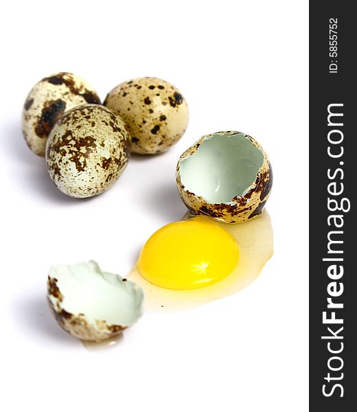 Quail Eggs broken and three more on group, on white background. Quail Eggs broken and three more on group, on white background