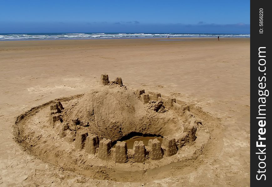 Sand castle on the sandy ocean beach. Sand castle on the sandy ocean beach