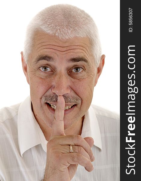 Senior man with silence gesture