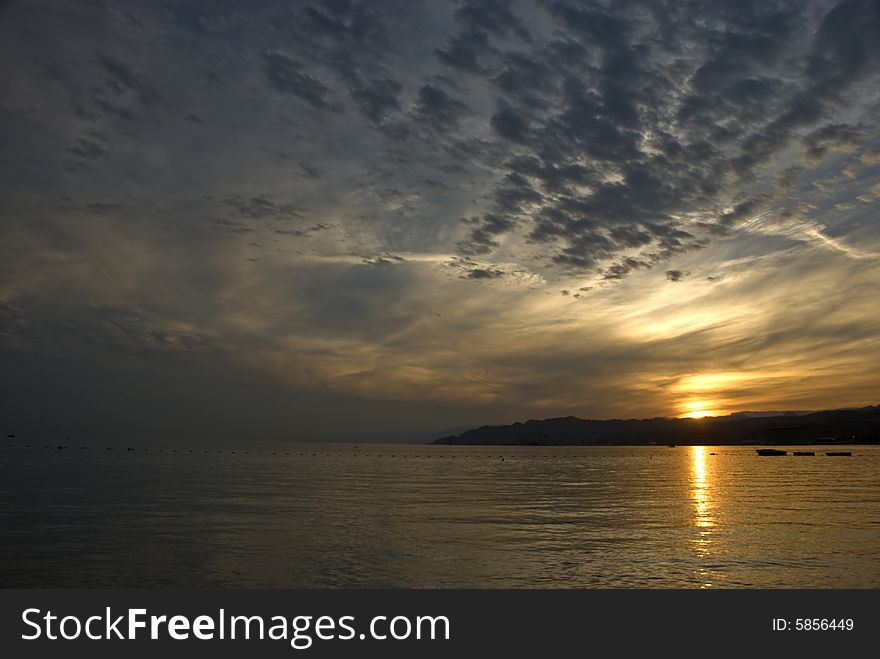 The shot was taken from the northern beach of Eilat - popular resort and recreation city in Israel, it is located on the Red Sea. The shot was taken from the northern beach of Eilat - popular resort and recreation city in Israel, it is located on the Red Sea