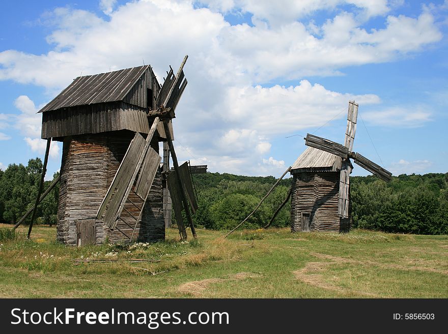 Two wind Mill worth on a field in solar weather