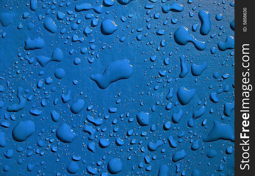 Water drops on blue surface.