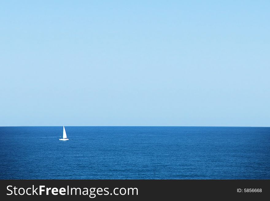 Sailing boat at an open sea. Sailing boat at an open sea