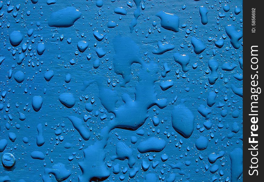 Water drops on blue surface.