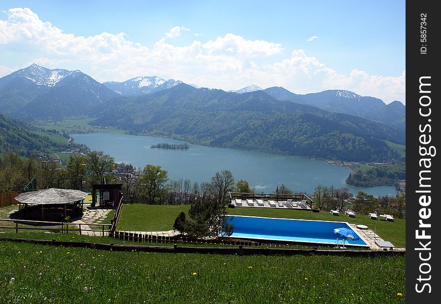 Sight from the peak of mountain to the Schliersee lake , Bavaria. Blue swimming pool in foreground .
Clouds above the mountains Bavarin   Alpes . The snow on the rocks. Sight from the peak of mountain to the Schliersee lake , Bavaria. Blue swimming pool in foreground .
Clouds above the mountains Bavarin   Alpes . The snow on the rocks.