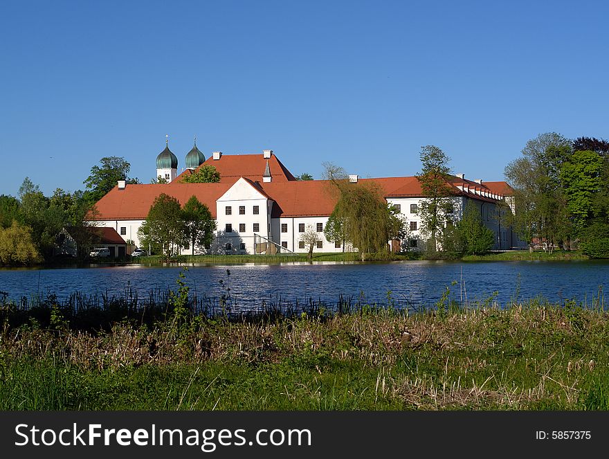 Old Monastery with Church on Seeon lake in  South Bavaria .  Not so far from Traunstein City and Chiemsee lake. Old Monastery with Church on Seeon lake in  South Bavaria .  Not so far from Traunstein City and Chiemsee lake.