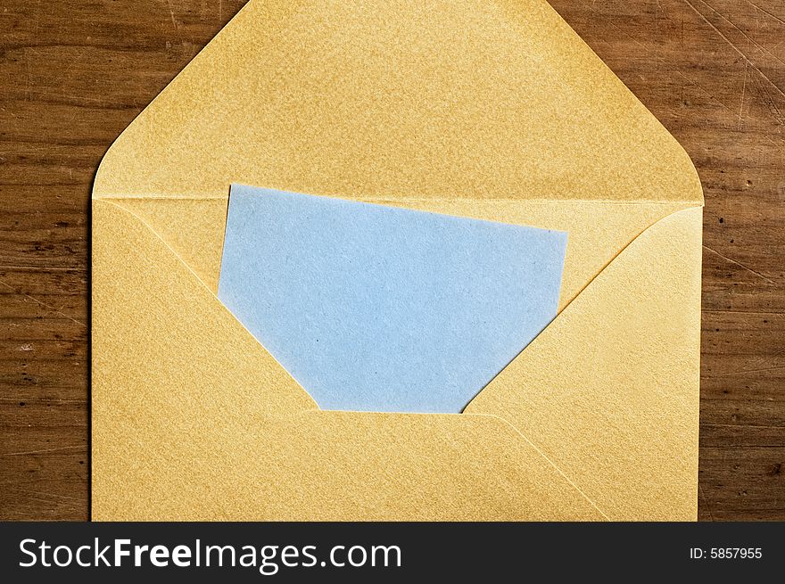 Open golden envelope with blue paper inside. Open golden envelope with blue paper inside.