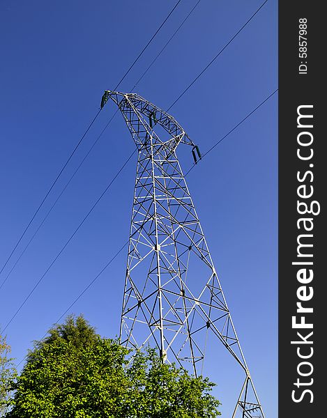 High voltage electricity pylon, in small city