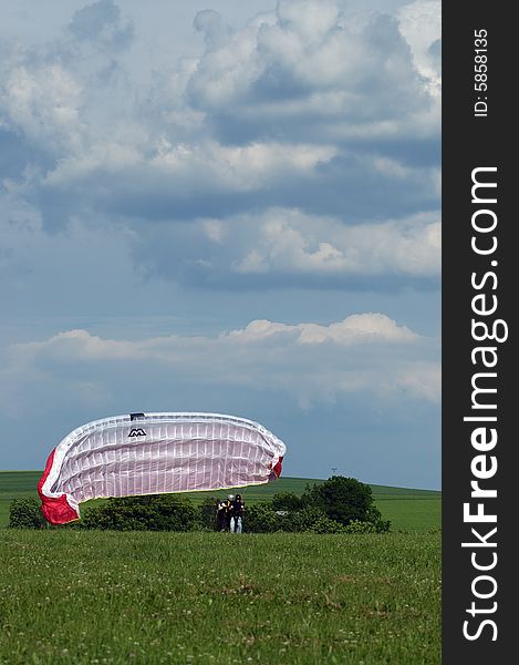 Tandem paragliding in cloudscape area