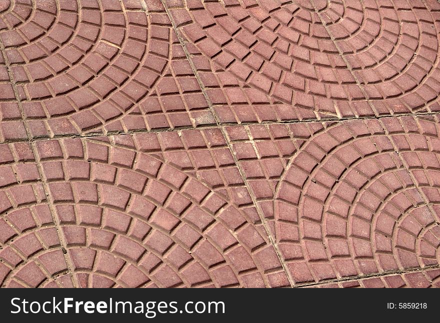 Close-up of new old-style pavement of stoneblocks (bricks) of red color