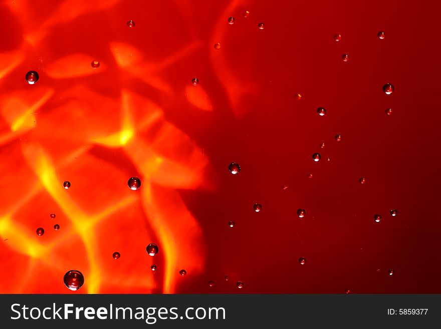 Drops of water on a red background. Drops of water on a red background.