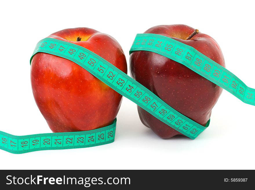 Two apples and measuring tape isolated on white background