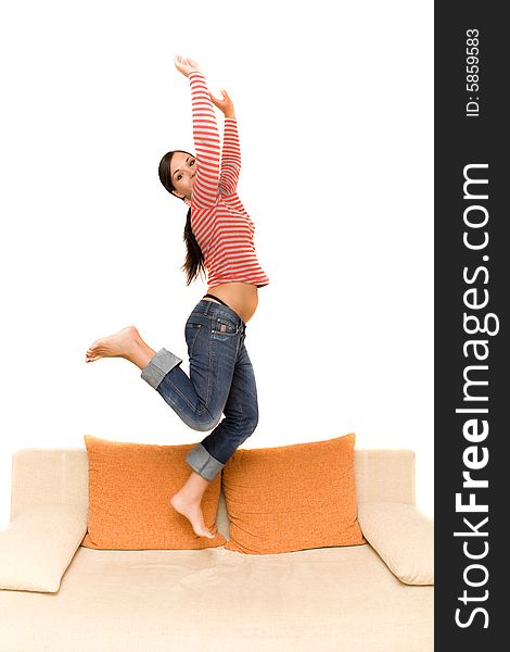 Attractive woman jumping on sofa. Attractive woman jumping on sofa