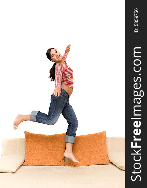 Attractive woman jumping on sofa. Attractive woman jumping on sofa