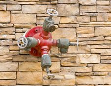 Fire Hydrant On Rock Wqll Royalty Free Stock Photography Fire Hydrant On Rock Wqll Royalty Free Stock Photography