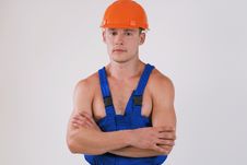 Worker In Blue Uniform And Helmet Stock Photos