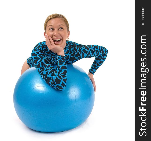 Girl leaning on a gym ball, smiling. Girl leaning on a gym ball, smiling